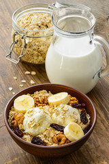 Healthy breakfast - whole grain muesli with a banana and ice
