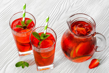 Cold strawberries drinks with strawberry slices and mint