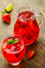 Cold strawberries drinks with strawberry slices and mint