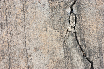 Cement floors are old and dirty.