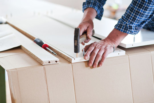 Man Assembling Flat Pack Furniture