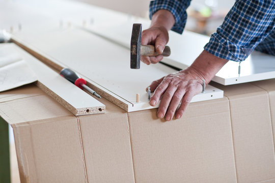 Man Assembling Flat Pack Furniture