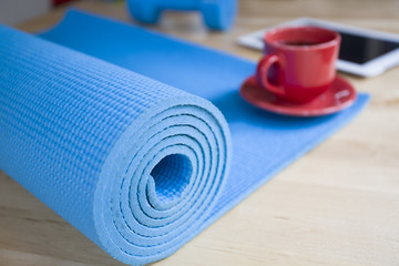 yoga mat and a cup of coffee