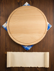 napkin cloth and cutting board on wood