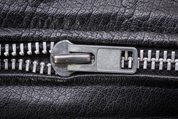Close-up shot of a zip of black leather dress © Giuliano Del Moretto