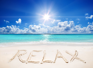 written relax on sand of the tropical beach with sun
