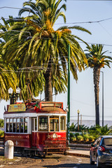 Fototapeta na wymiar Historic red tram in Lisbon, Portugal.