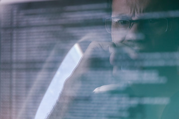 Young Man Using a Laptop during a Flight