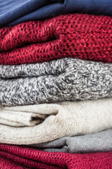 Fototapeta na wymiar Stack of handmade wool sweaters