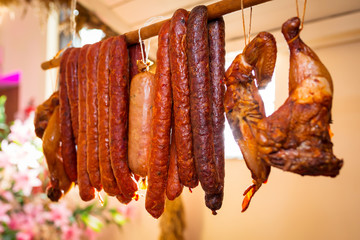 Smoked sausages meat hanging on the pole