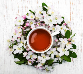 Cup of tea and spring blossom