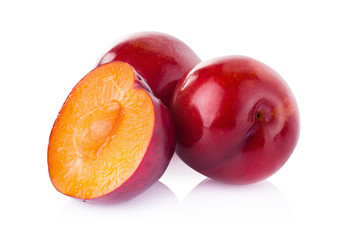 plums isolated on white