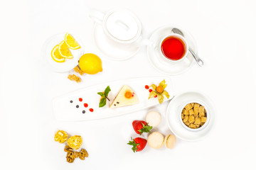 cake served with fresh fruits and tea