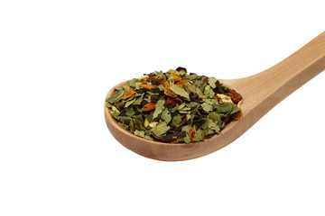Dry herbal tea in spoon, isolated on  white background