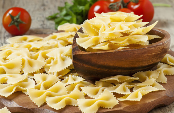 Dry Italian pasta farfalle, selective focus