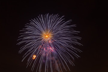Evening fireworks in sky in honor of celebration of Victory Day
