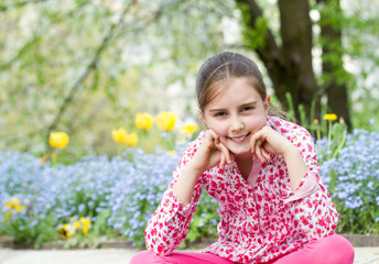 Outdoor portrait of cute little girl on the meadow