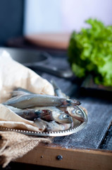 Fresh sardines. Fish with vegetables.