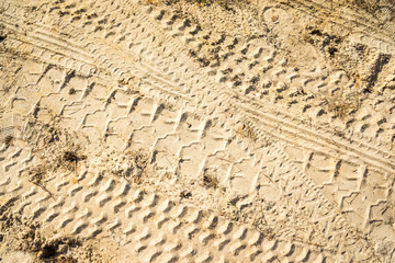 footprints in the sand on cars