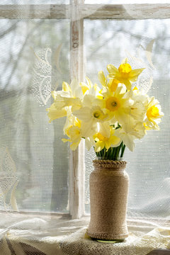 bouquet of the fresh narcissus on a windowsill
