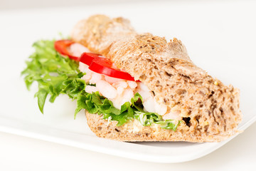 Prawn sandwich on white plate