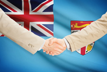 Businessmen handshake with flag on background - Fiji