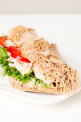 Prawn sandwich on white plate vertical