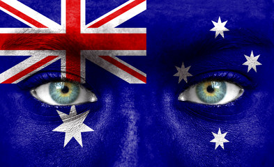 Naklejka premium Human face painted with flag of Australia