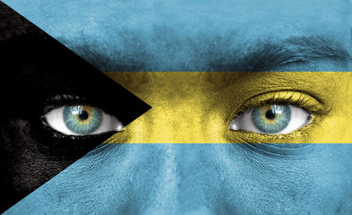 Human face painted with flag of Bahamas