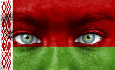 Human face painted with flag of Belarus