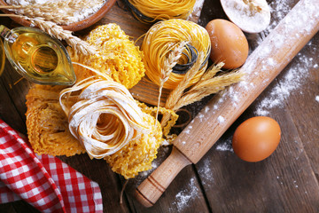 Still life of preparing pasta on rustic wooden background