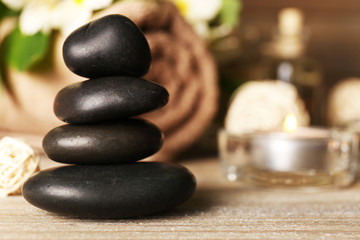 Beautiful spa composition with stones on table close up
