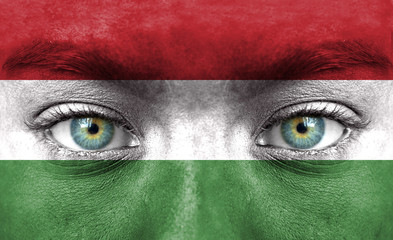 Fototapeta premium Human face painted with flag of Hungary