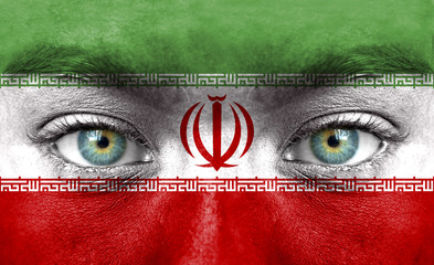 Human face painted with flag of Iran
