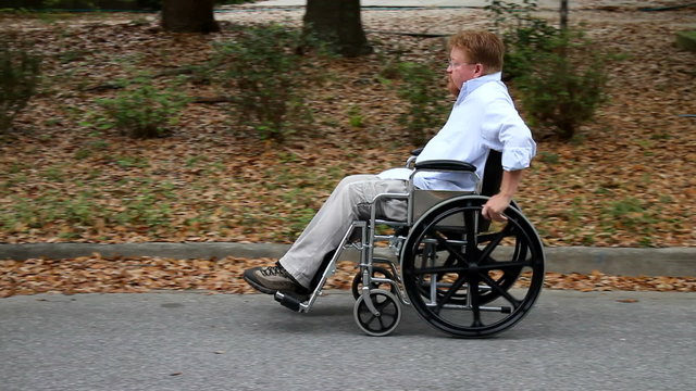 Disabled Man Using Wheelchair Pan