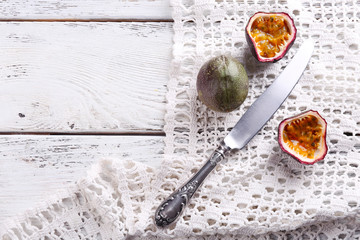 Passion fruits on color wooden background