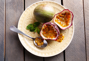 Passion fruits on wooden background