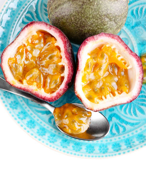 Passion fruit on plate isolated on white