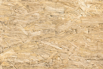 Chipboard wood background and alternative construction material
