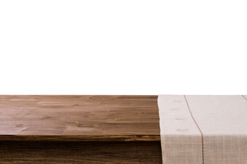 Empty wooden table with napkin and white background