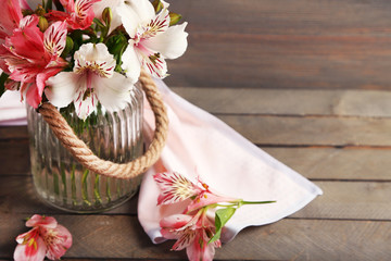 Bouquet of alstroemeria on wooden background