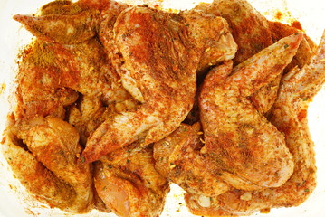 Chicken meat marinated in spices and ready for grilling