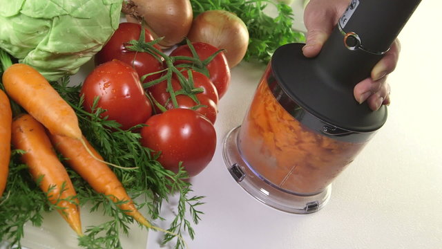 Using stick hand blender with chopper  for chopping row carrot