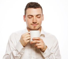 man holding white cup with coffee