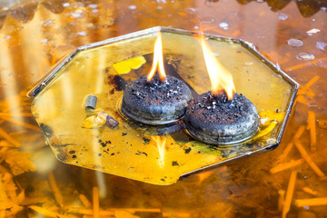 Oil flame lamp in Thai temple
