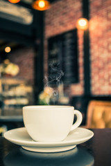 Coffee cup on the table at the coffee shop.