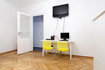 Tv and computer in hostel common area