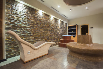 Modern spa interior with hot stone chairs
