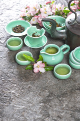 Teapot and cups on stone table. Asia style stil life