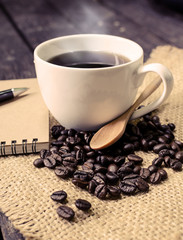 Cup of coffee and coffee beans